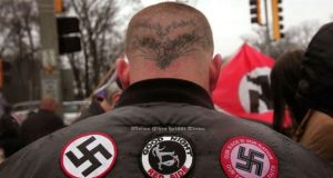 SKOKIE, IL - APRIL 19: Neo-Nazi protestors organized by the National Socialist Movement demonstrate near where the grand opening ceremonies were held for the Illinois Holocaust Museum & Education Center April 19, 2009 in Skokie, Illinois. About 20 protestors greeted those who left the event with white power salutes and chants. Scott Olson/Getty Images/AFP == FOR NEWSPAPERS, INTERNET, TELCOS & TELEVISION USE ONLY == *** Local Caption *** NEO NAZILER